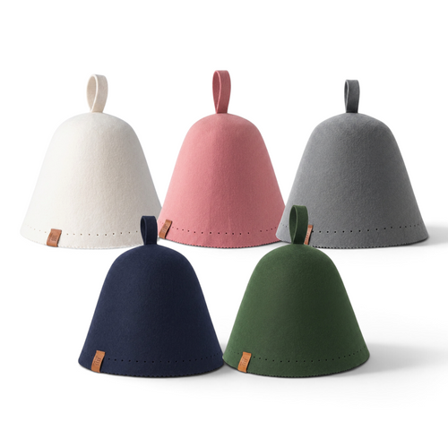 Cream, pink and gray sauna hats behind navy and forest green ones on a white backdrop