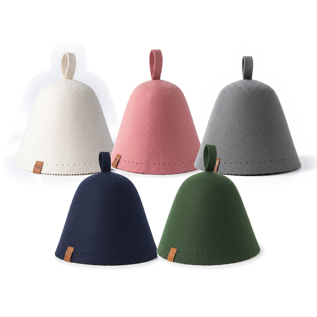 Lanoviss colour lineup: cream, pink and gray hats behind navy and forest green on white